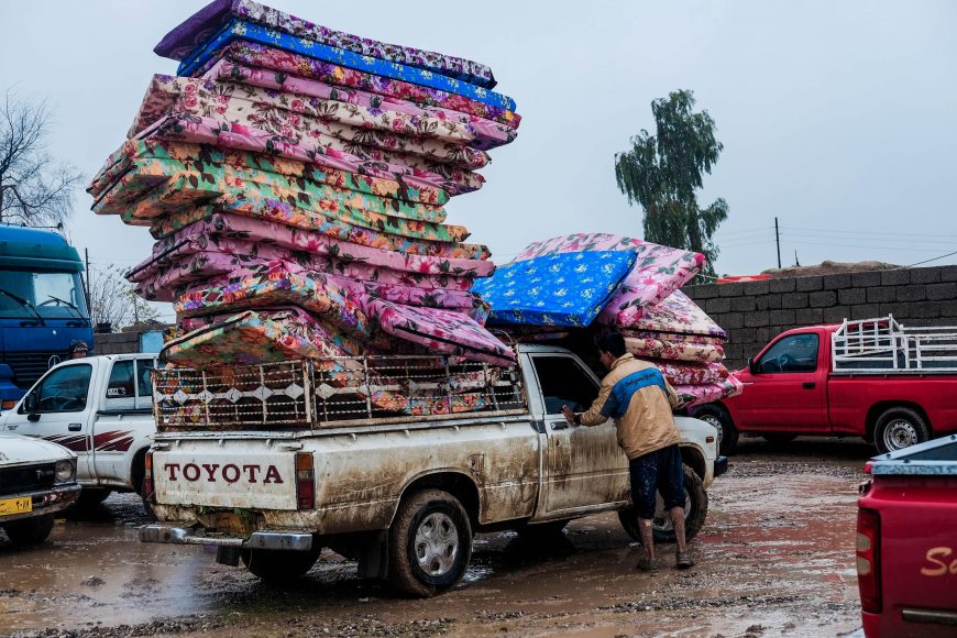 Piles of new mattresses awaiting distribution in Hawiga, Iraq.