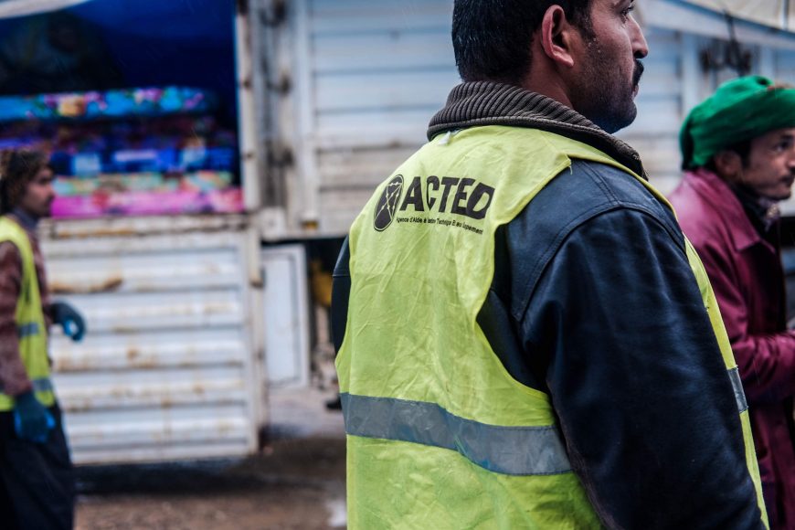 Local community members distribute aid items